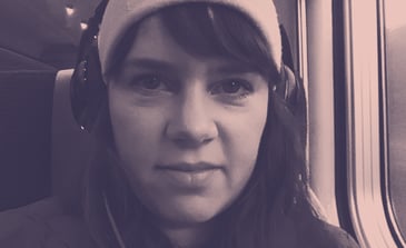 Woman in train with headphones