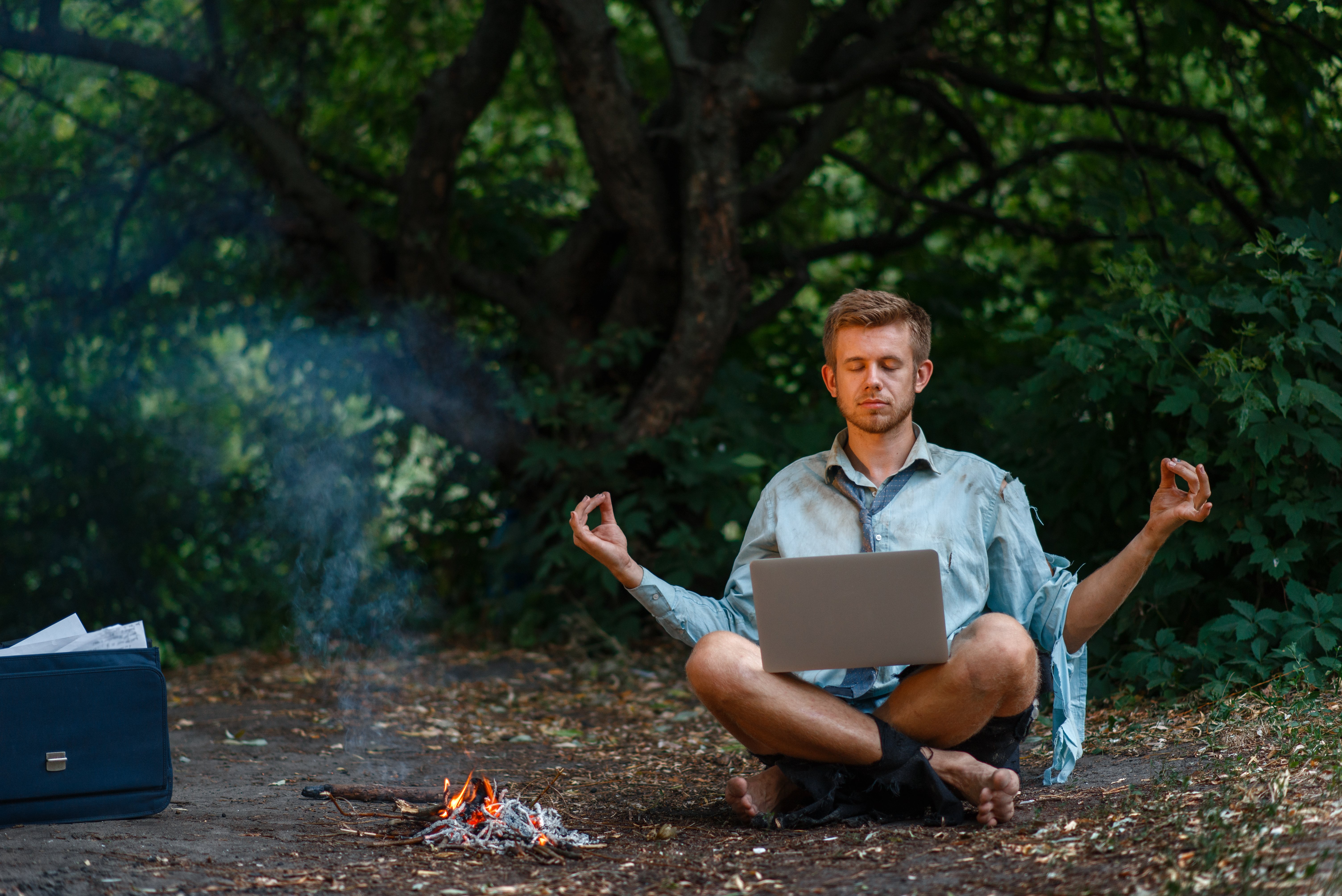 alone-businessman-with-laptop-at-fireplace-island-2021-08-26-16-27-18-utc